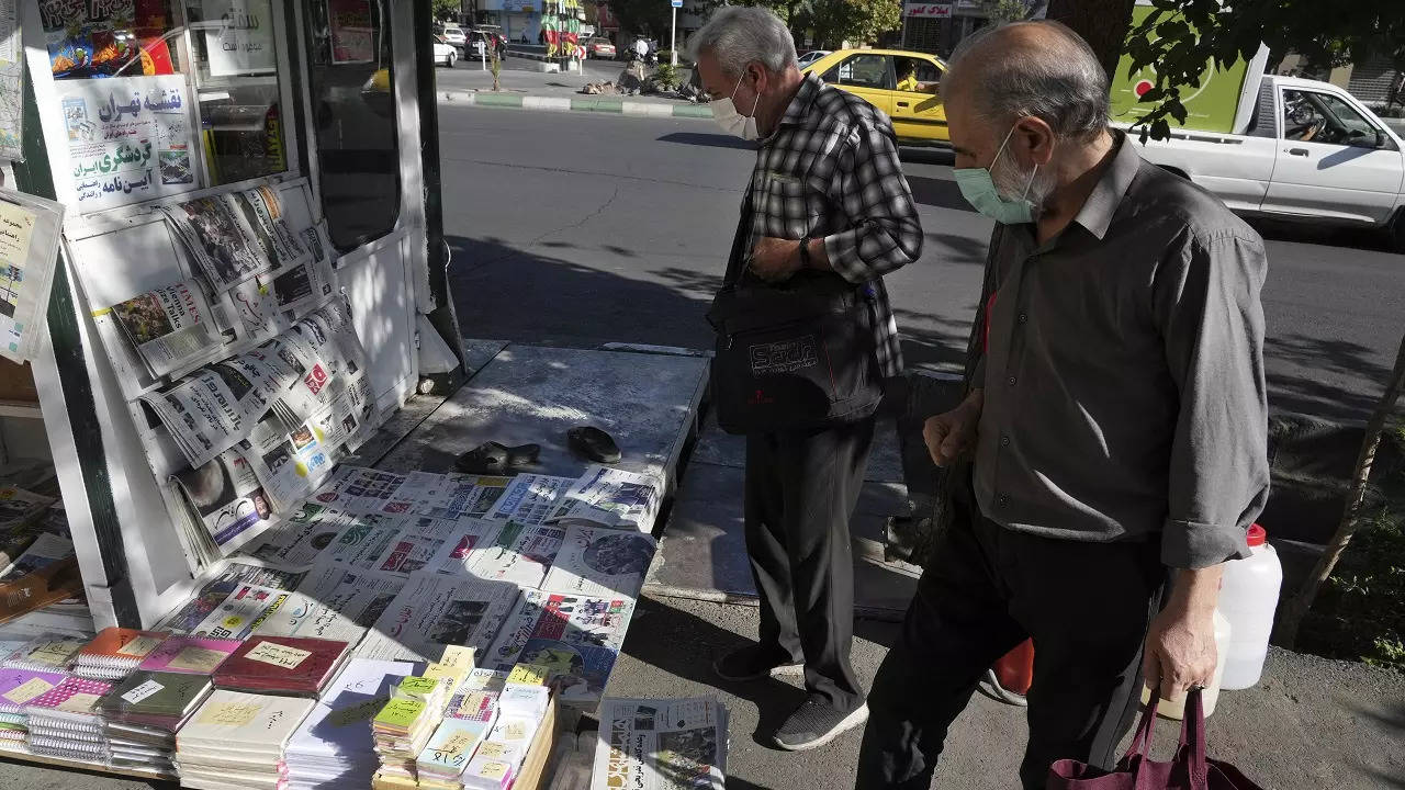 ​People scan publications at a news stand in Tehran in Iran on Saturday​