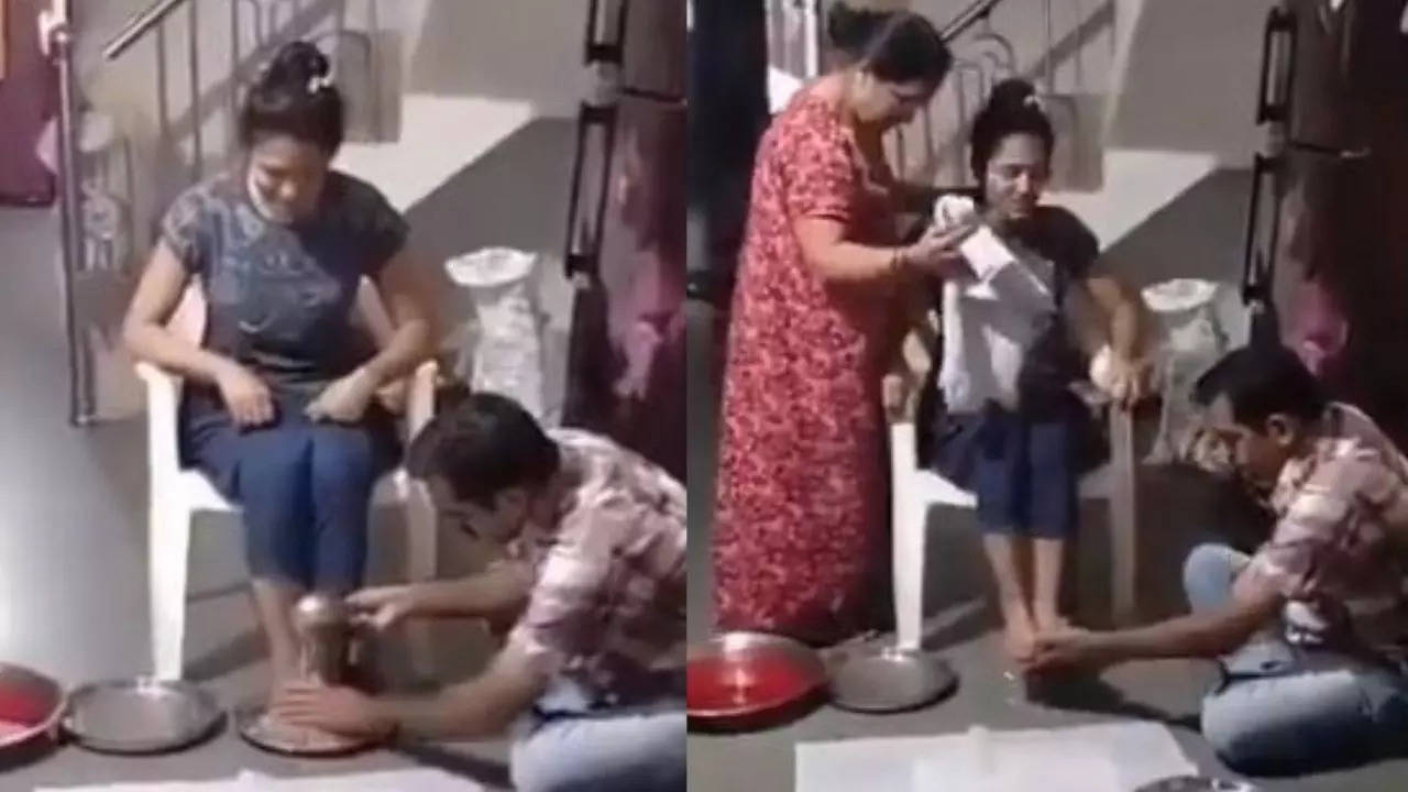 Parents wash daughter's feet with milk