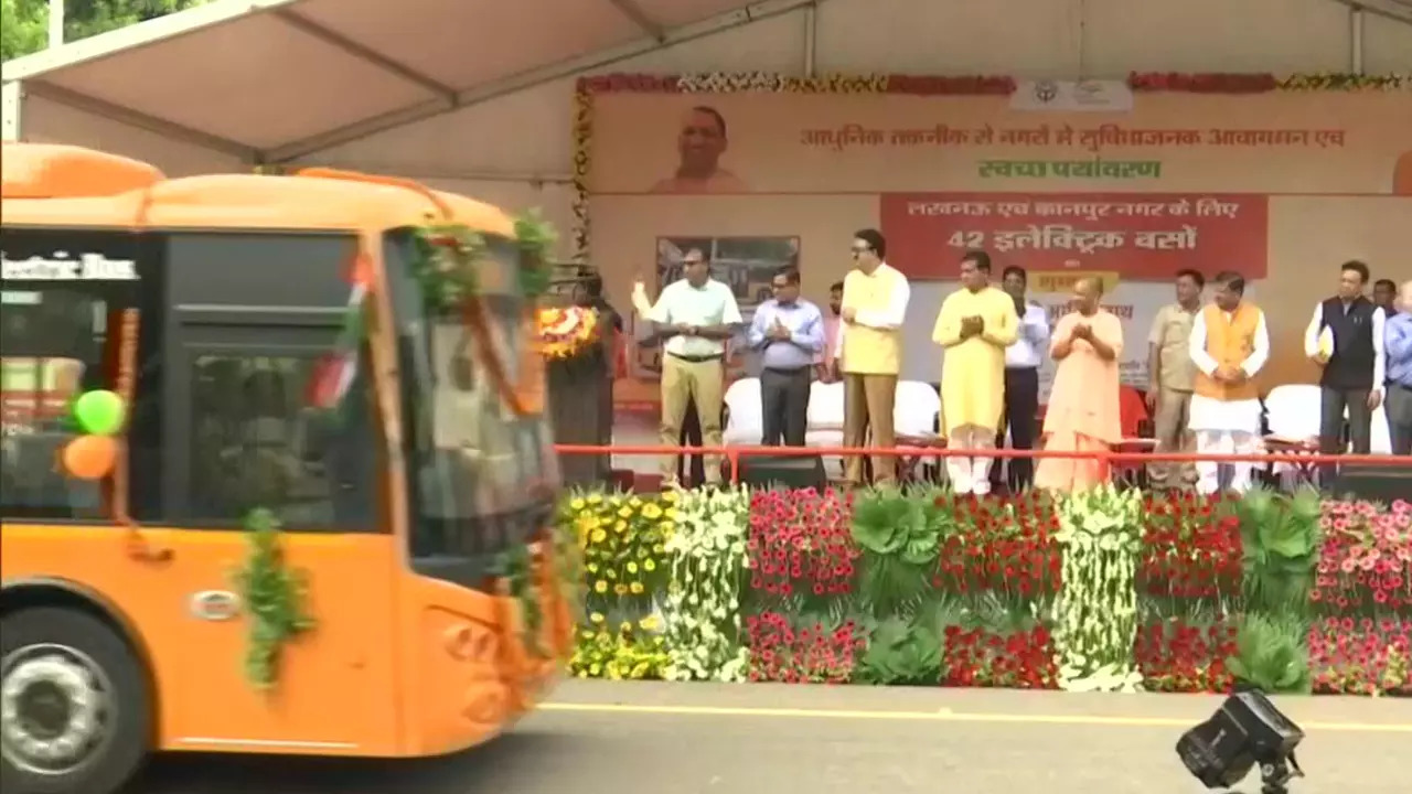 Yogi Adityanath flagging off electric buses.