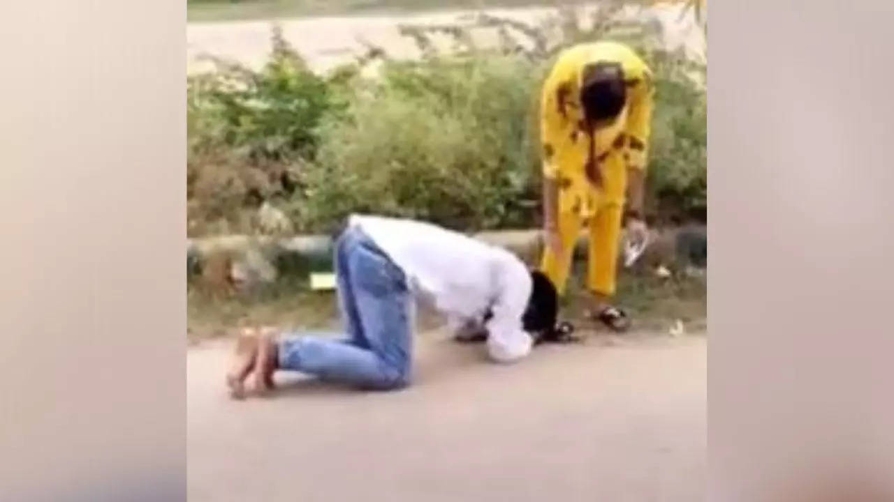 Man falling at the feet of a girl