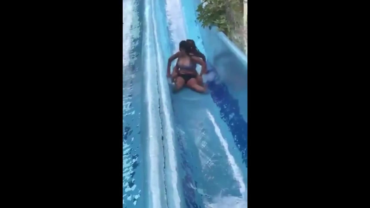 Viral video: Girls stuck on waterslide sent flying after woman slams into  them