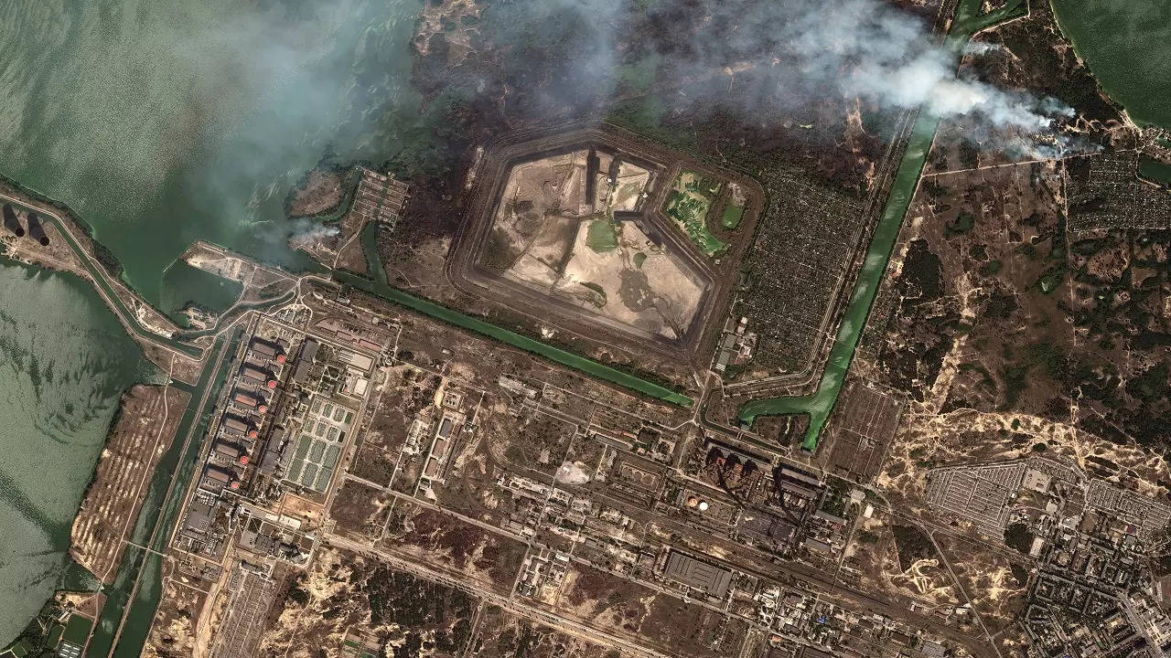 This satellite image provided by Maxar Technologies shows bush fires outside of the main power plant facilities at the Zaporizhzhia nuclear plant in Russian occupied Ukraine