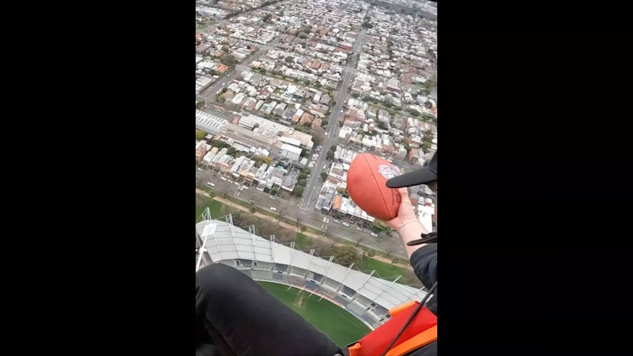 Brendan Fevola caught an American football dropped from a height of over 700 feet | Screengrab from video by Guinness World Records