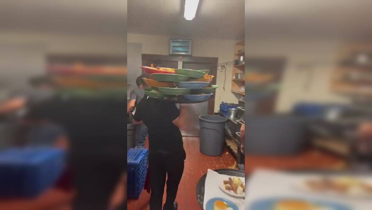 Viral Video Waiter lifts over dozen plates in one hand to serve