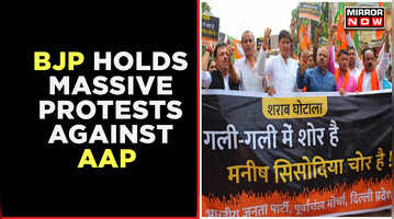 BJP Vs AAP Continues Over Liquor Scam  Protestors Demand Suspension Of Arvind Kejriwal Government