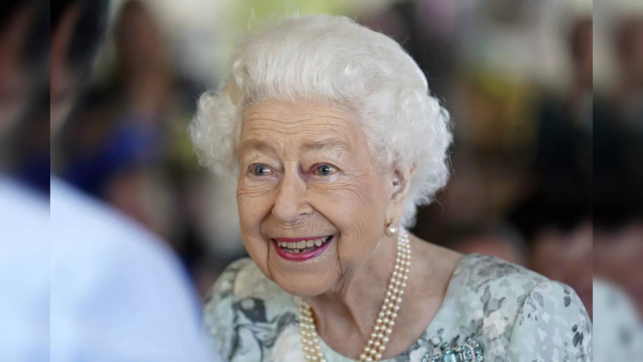 FILE - Britain's Queen Elizabeth II looks on during a visit to officially open t...