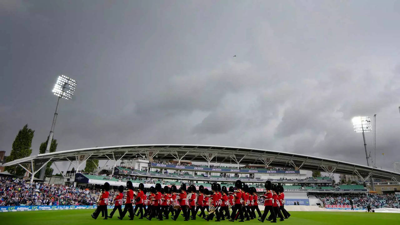 The Band of The Household Cavalry leaves the pitch as rain delays the start of play on the first day of the test match between England and South Africa at the Oval