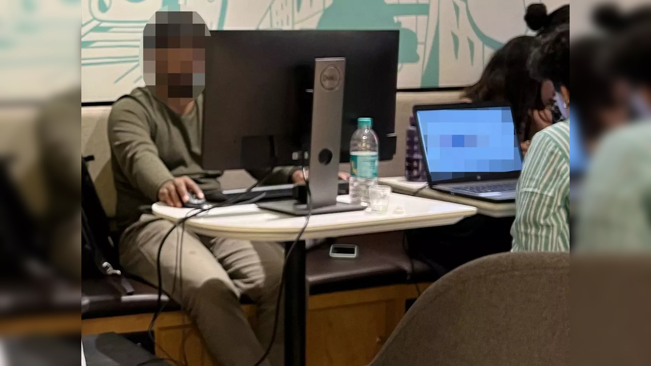 Man works on a desktop at Third Wave Coffee in Bengaluru | Picture courtesy: Twitter/@sanketsahu