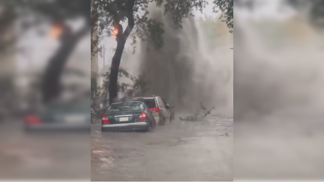 Sewage water erupts  out of manhole