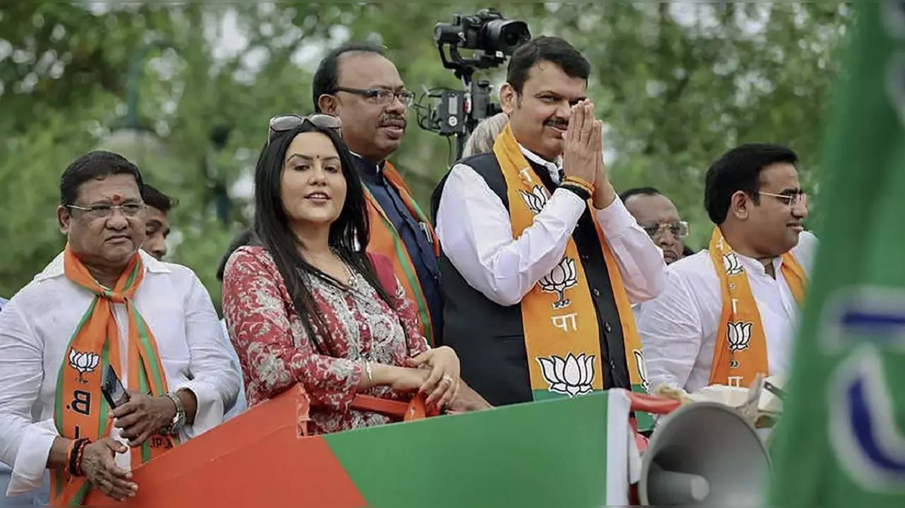 Maharashtra Deputy CM Devendra Fadnavis, with wife Amruta, in Nagpur on Tuesday.