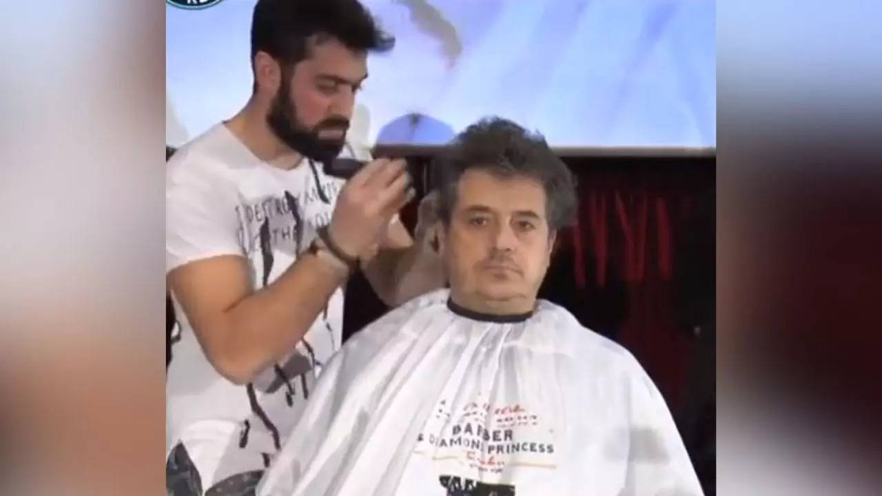 Greek hairdresser cuts hair in just 47 seconds to set Guinness World Record  - Watch viral video