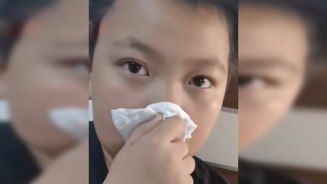 School kid pretends to be allergic to smell of books