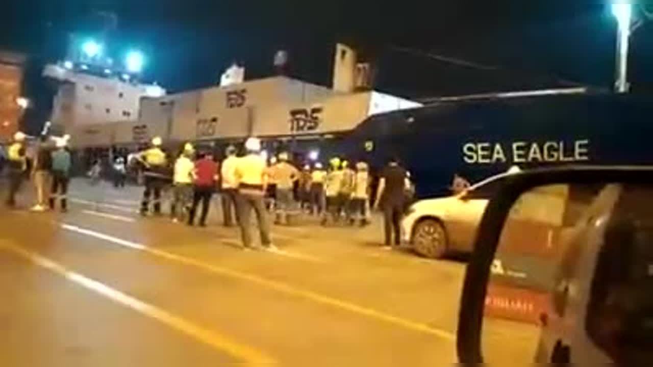 Viral: Huge Cargo Ship Capsizes While Offloading Containers; Onlooker 