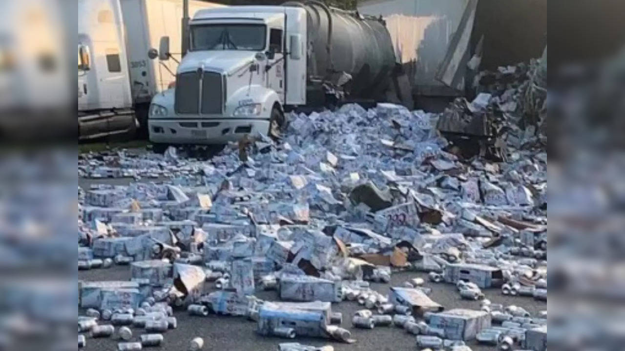 Hundreds of beer cans were spilled onto a Florida highway after a crash involving five trucks and a pickup | Picture courtesy:  Twitter/@FHPTampa