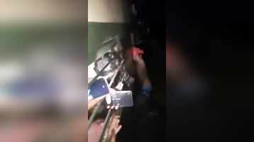 Viral video Passengers hold shirtless phone thief hanging from train window in Bihar 5km
