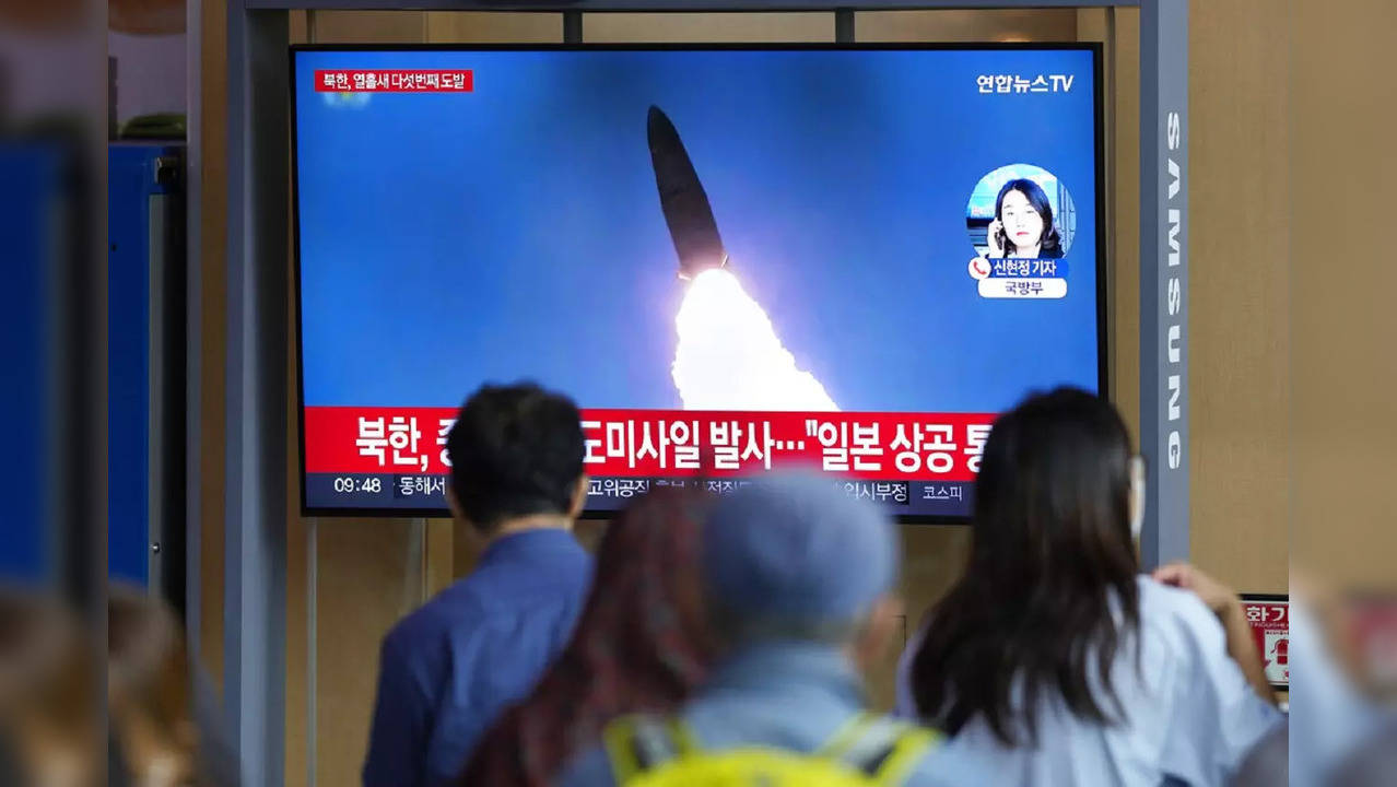 A TV screen showing a news program reporting about North Korea's missile launch with file footage, is seen at the Seoul Railway Station in Seoul