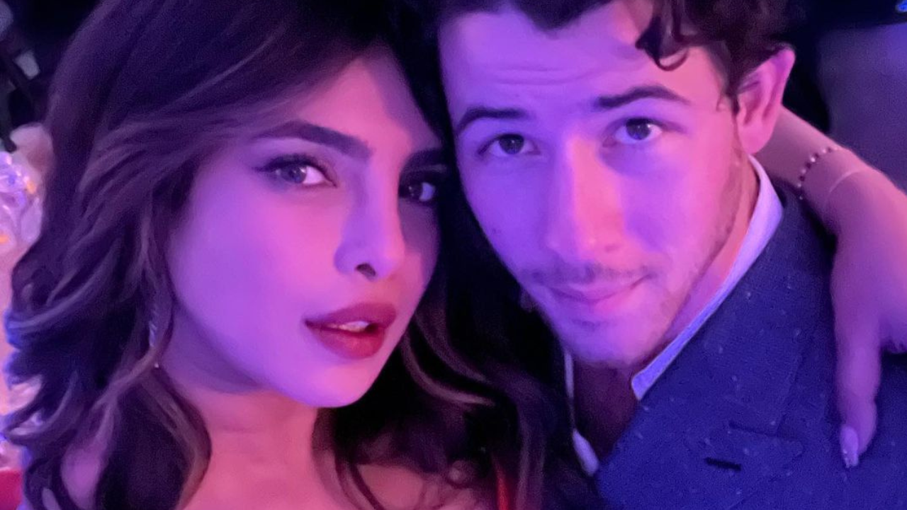 Priyanka Chopra rocks red bodycon dress with plunging neckline as she steps out with beau Nick Jonas for a wedding festivity