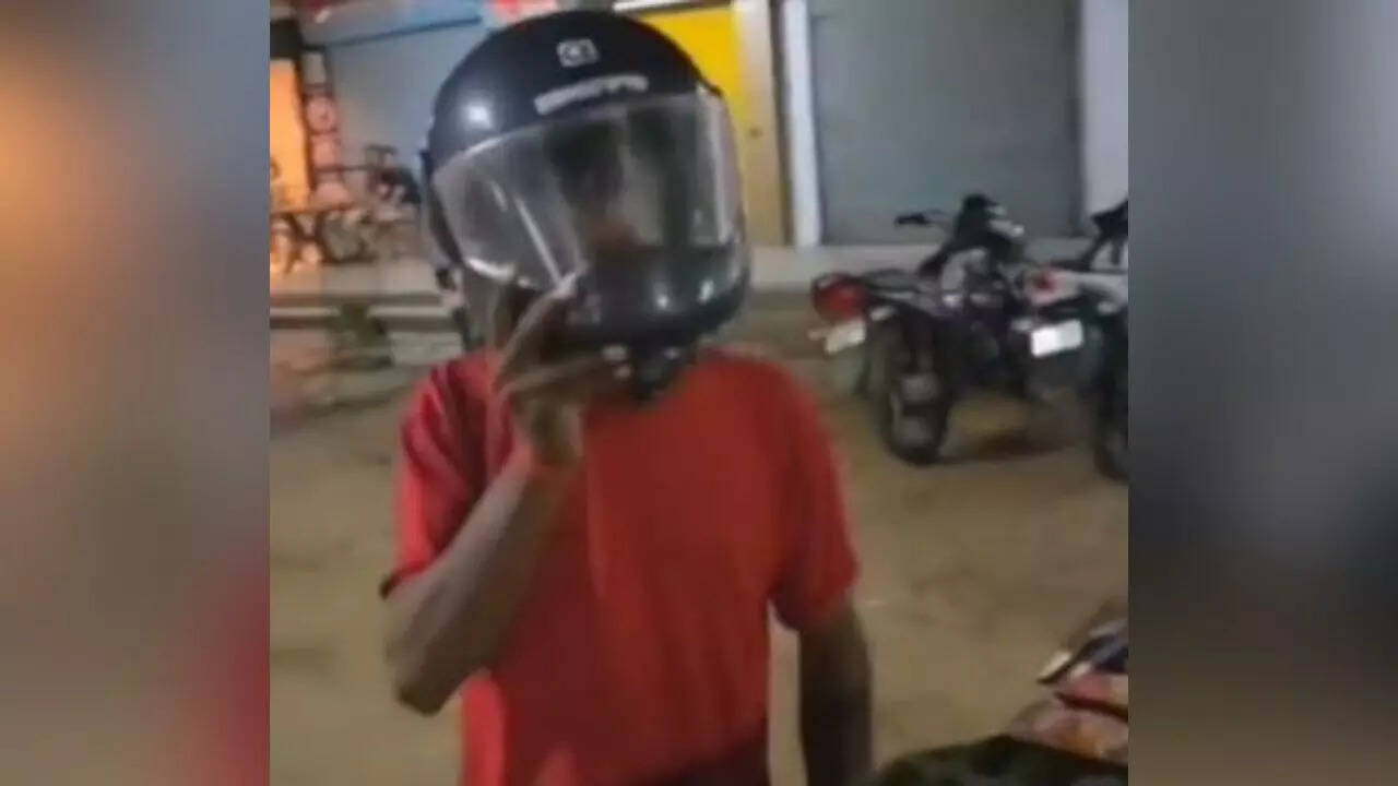 Vegetable vendor wears helmet