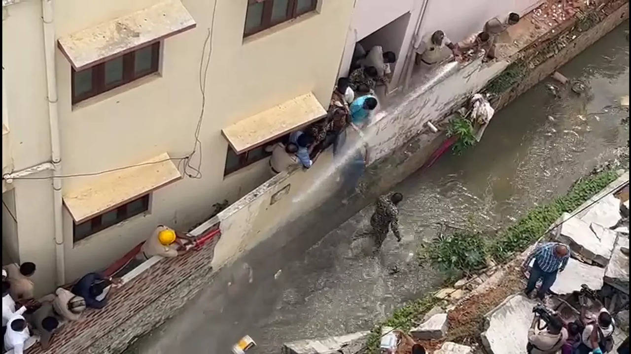 The viral video of the incident shows officials throwing water was on them using hosepipe and buckets.