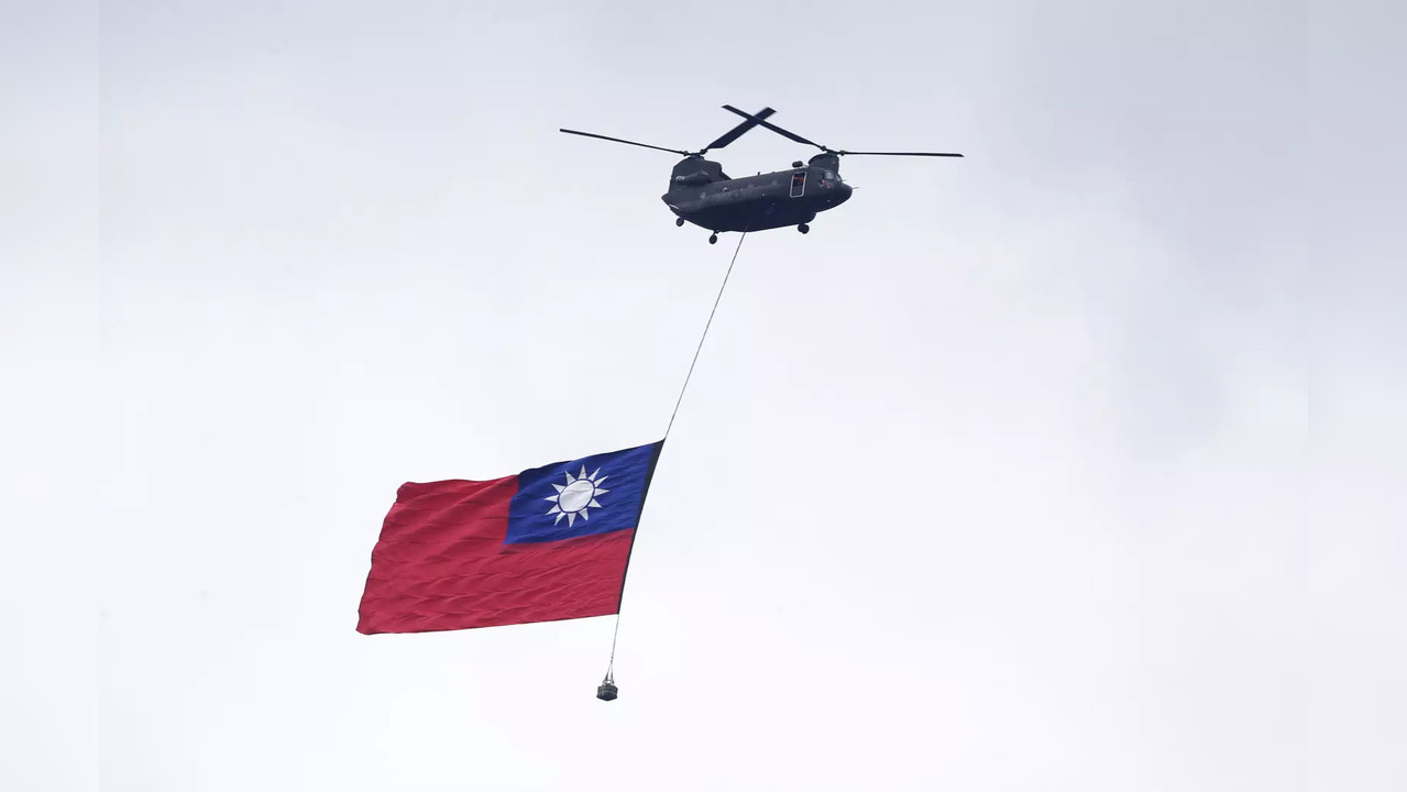 Helicopters fly over the President Office with the Taiwan national flag during National Day celebrations in Taipei