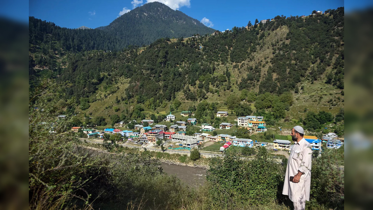 Keran: A man standing on a hill-lock looks towards the Pakistan occupied Kashmir...