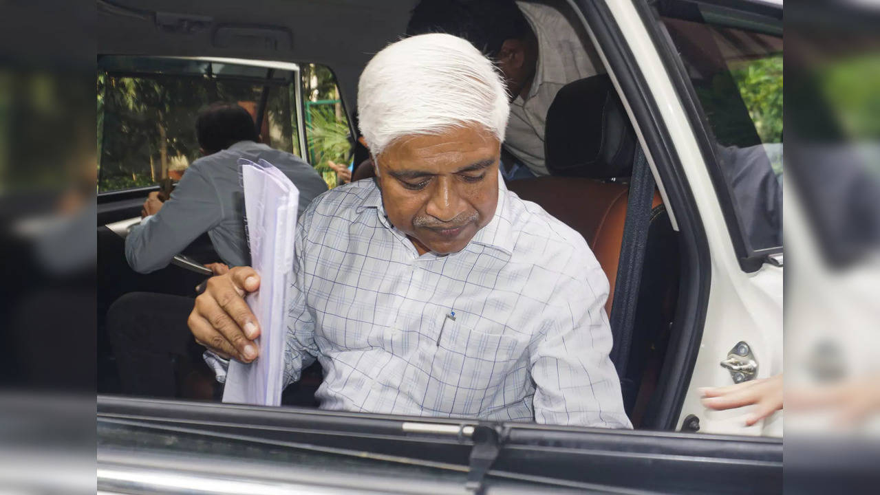 Former Delhi minister Rajendra Pal Gautam appears for questioning at Paharganj police station in New Delhi