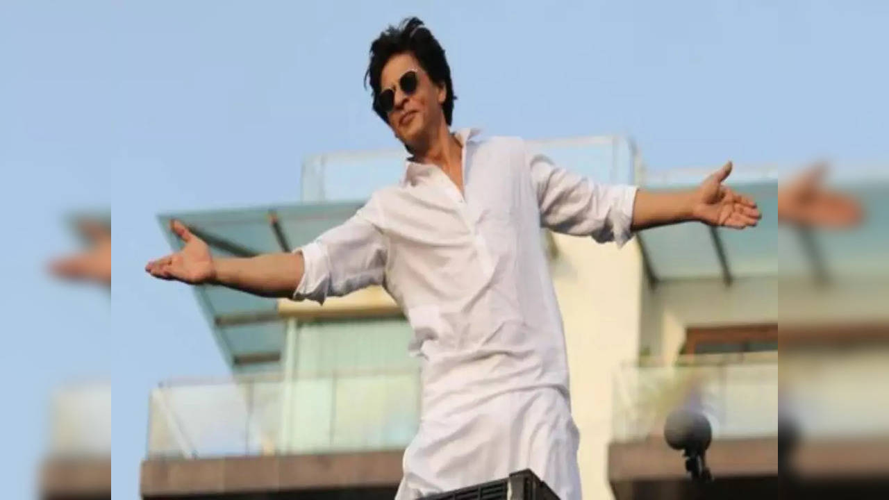 Shah Rukh Khan strikes his iconic signature pose at an event in Delhi
