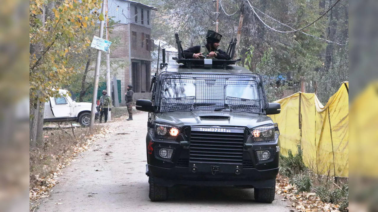 Security personnel patrol the site where an encounter took place between security forces and terrorists in Anantnag on Tuesday