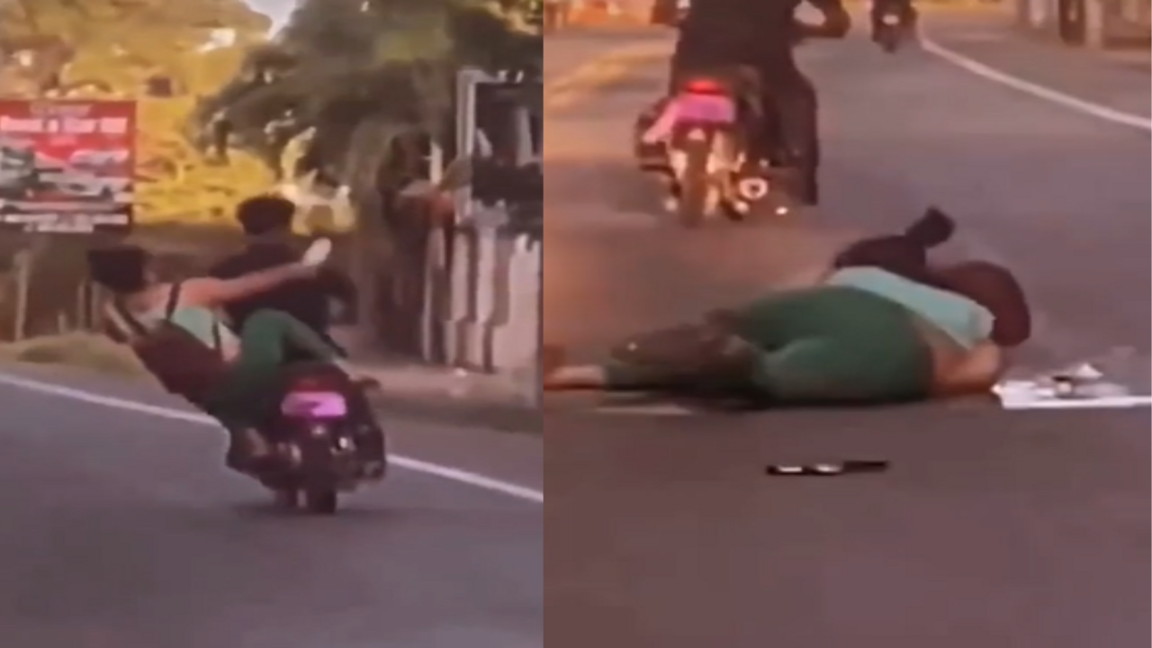 Woman falls while trying to kick bike rider