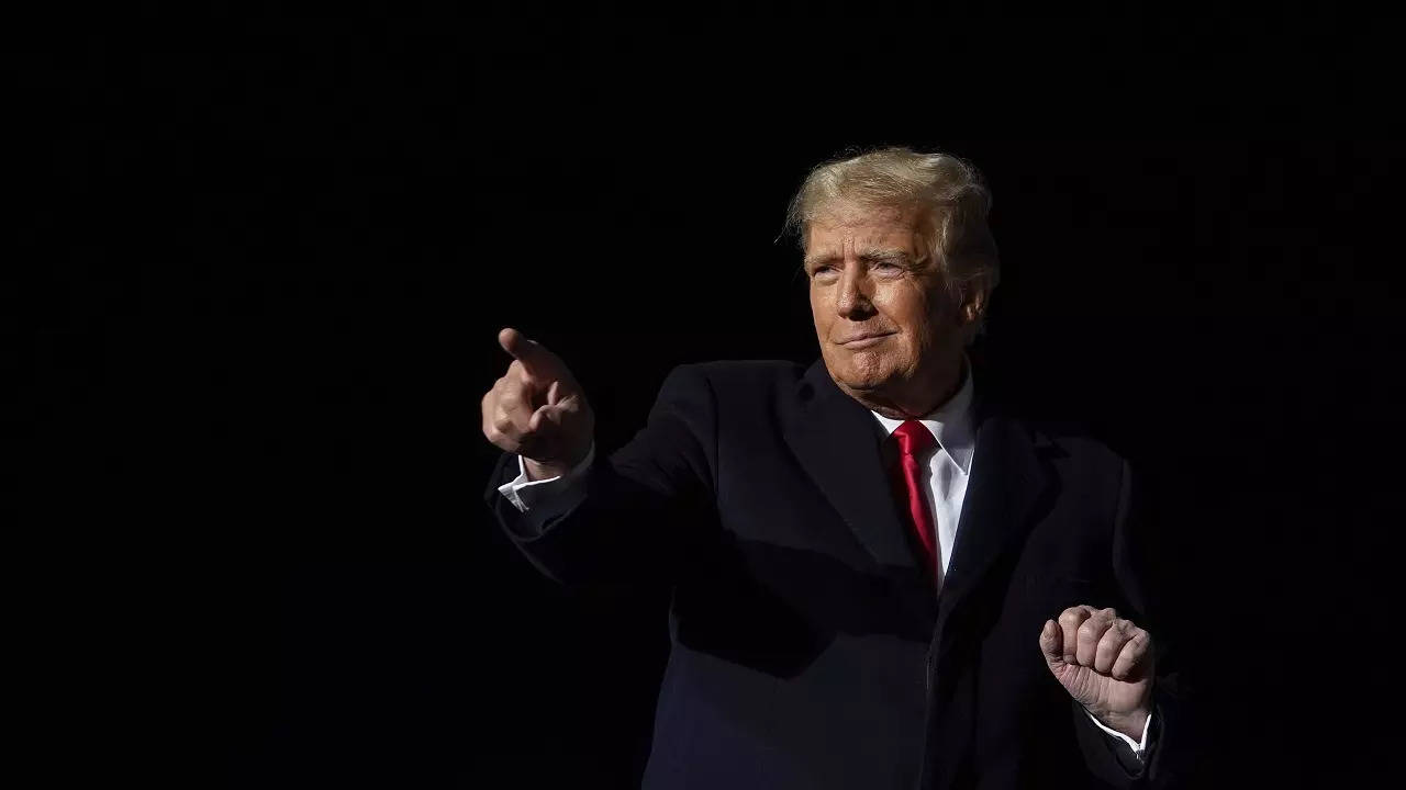 Former President Donald Trump dances after he finished speaking at a campaign rally