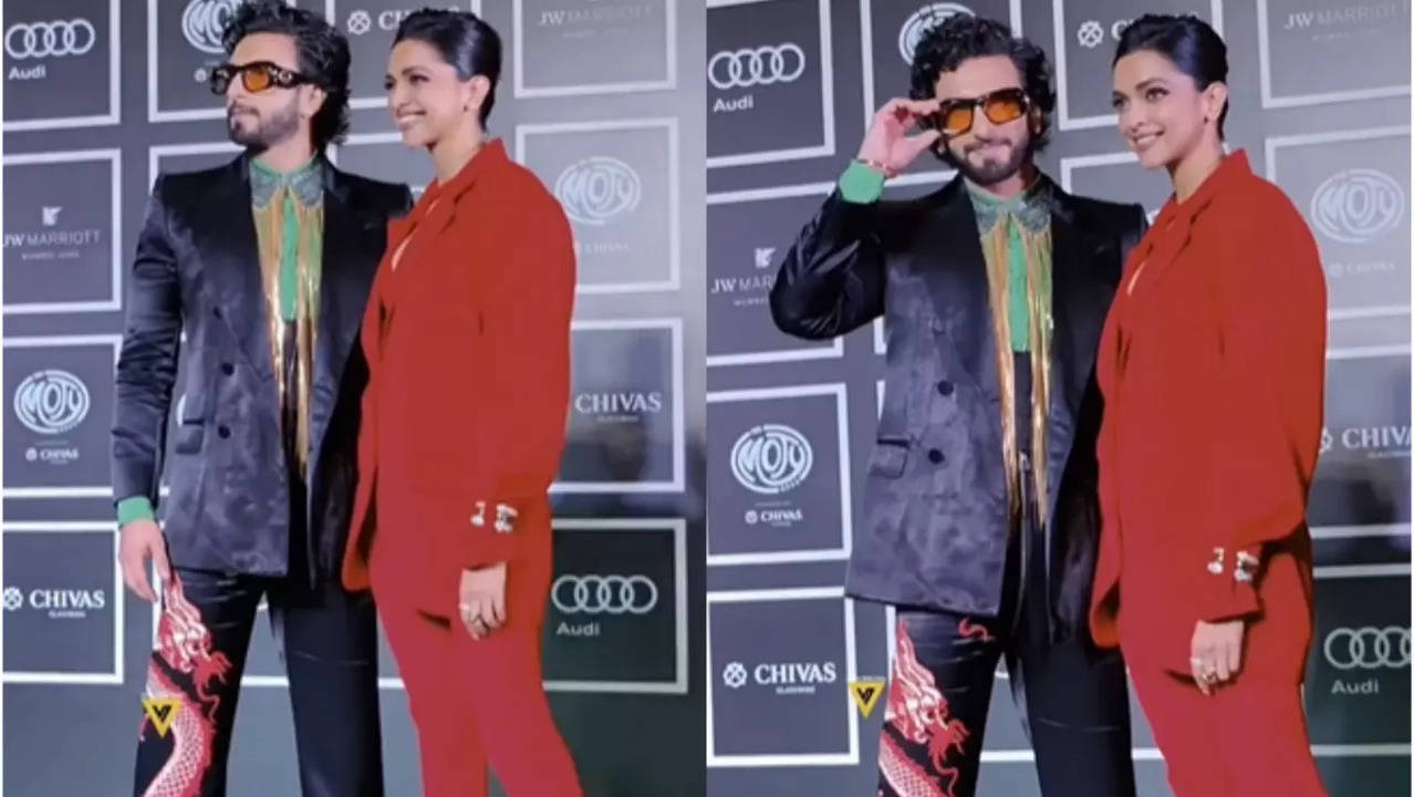 Ranveer Singh in dragon pants and Deepika Padukone in red outfit