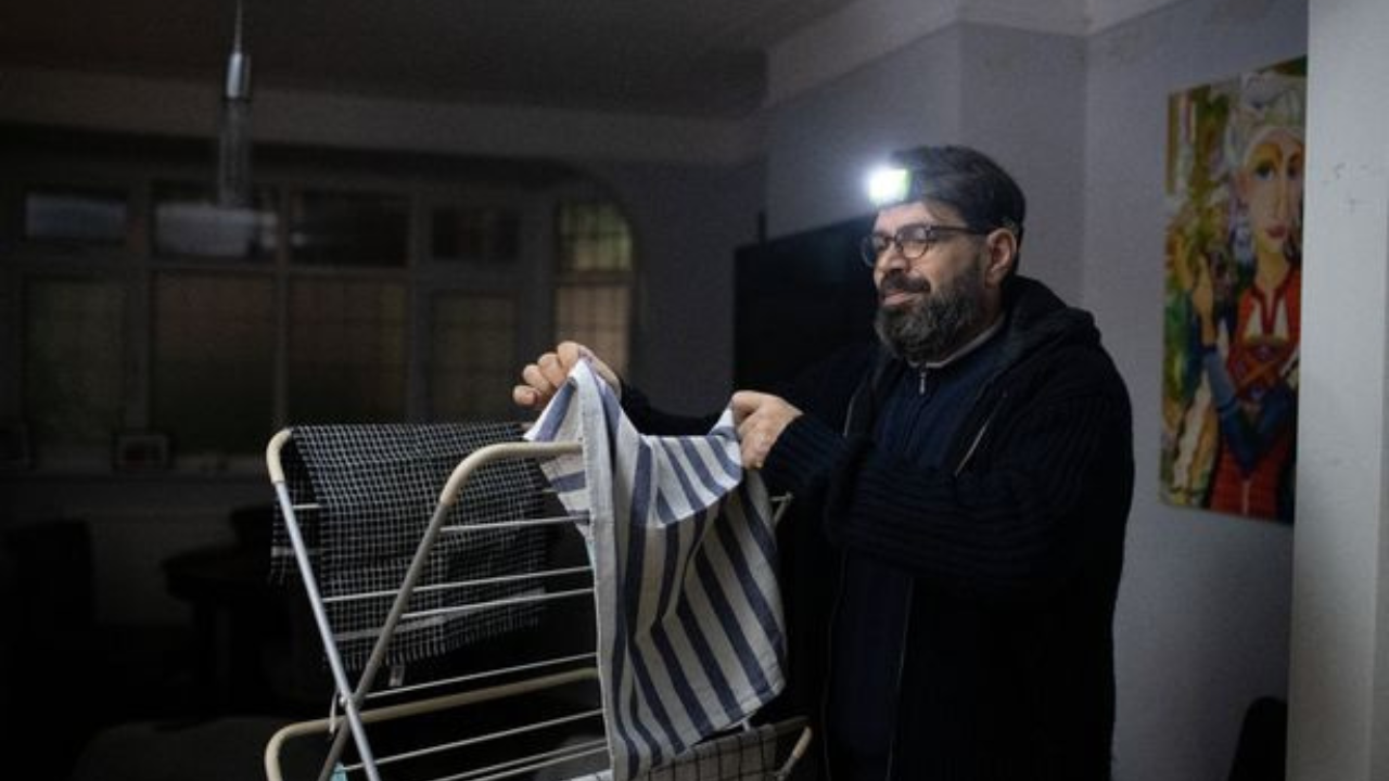 Chavdar Todorov uses a head torch in the dark to reduce annual electricity bill | Picture courtesy: Facebook/Lancs Live