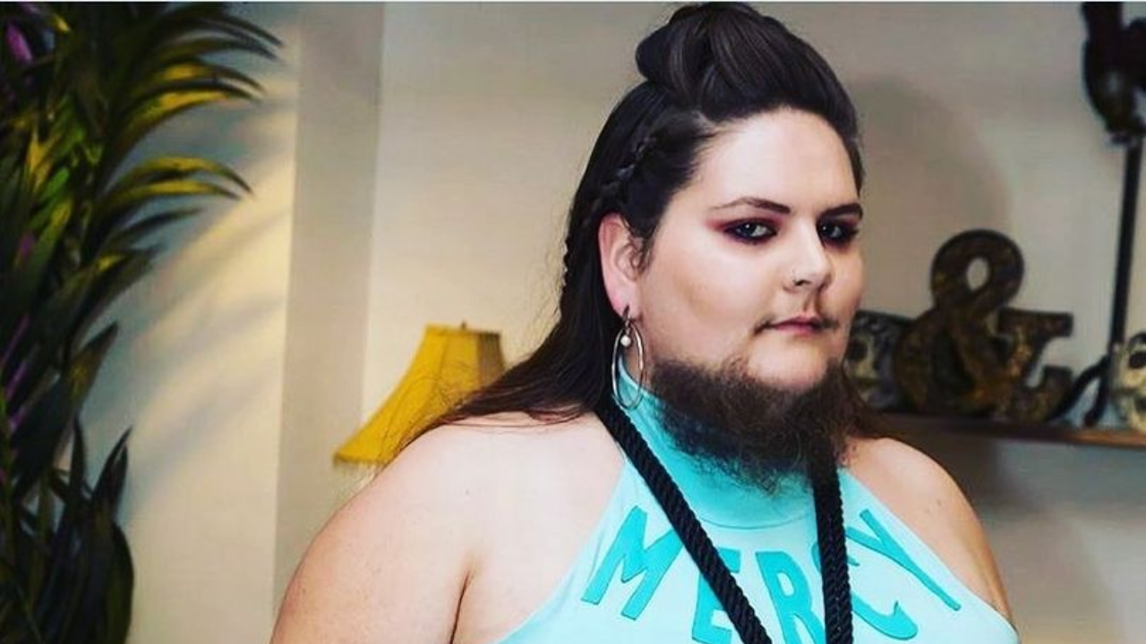 Woman, who shaved twice a day after growing beard at 13, embraces facial hair