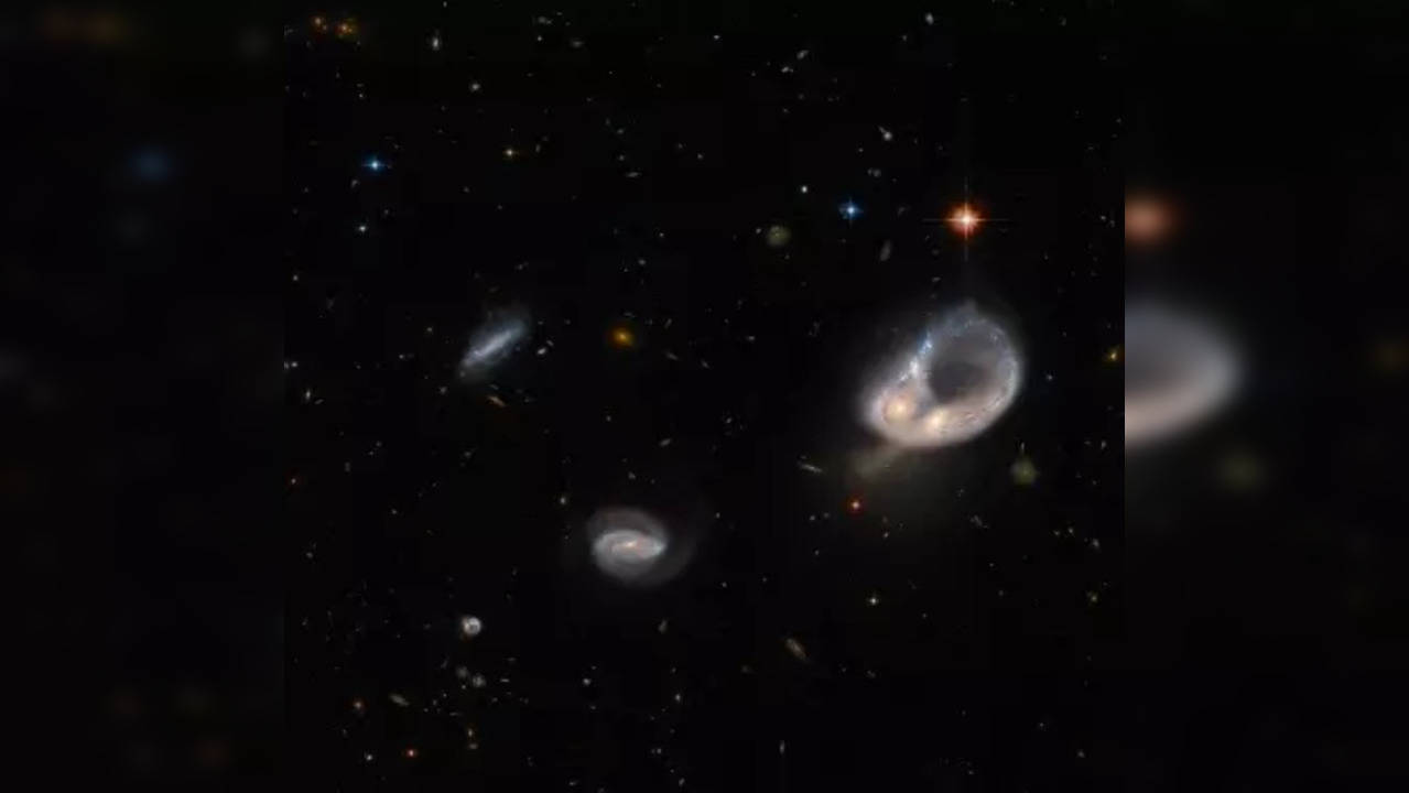 Hubble Captures Unusual Galaxy Merger In Ancient Universe | Technology ...