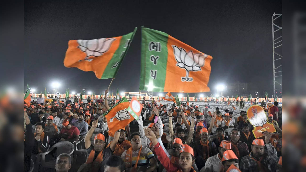 BJP supporters wave party flag during Prime Minister Narendra Modi's public meeting ahead of Gujarat Assembly elections | Representational image