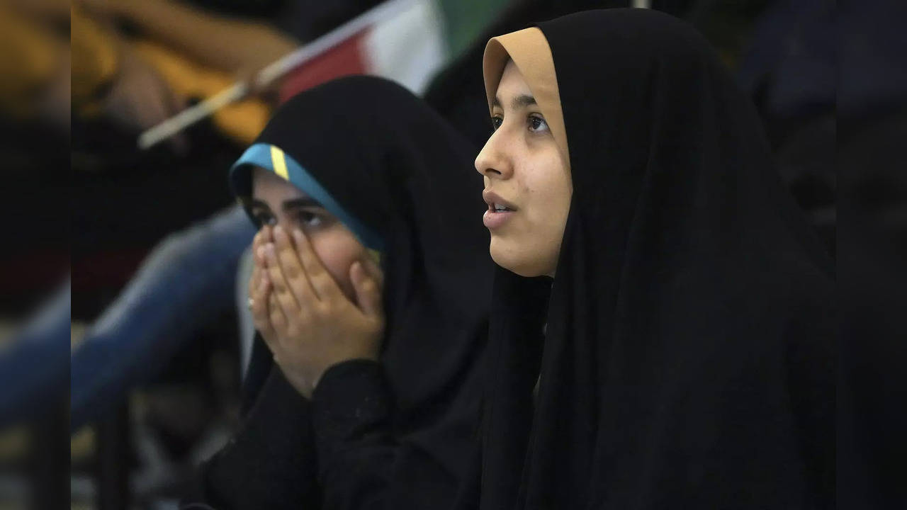 Iranian fans watch their national soccer team play against the United States in Qatar's World Cup