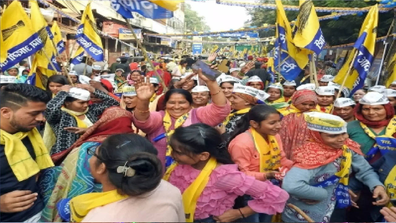 AAP workers during a roadshow in Delhi.