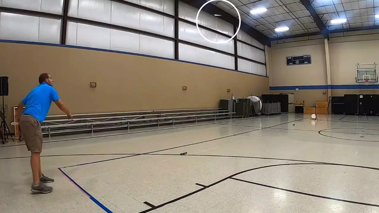 The Guinness World Record for the farthest distance to hit a target with a paper aircraft (49.21 feet) was achieved by David Rush | Screenshot courtesy of David Rush