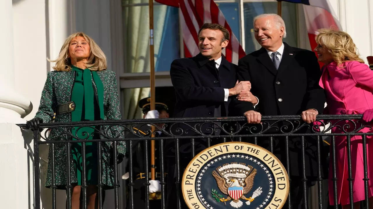 President Joe Biden and first lady Jill Biden with French President Emmanuel Macron and his wife Brigitte Macron stand on the Blue Room Balcony during a State Arrival Ceremony on the South Lawn of the White House in Washington, Thursday, Dec. 1, 2022