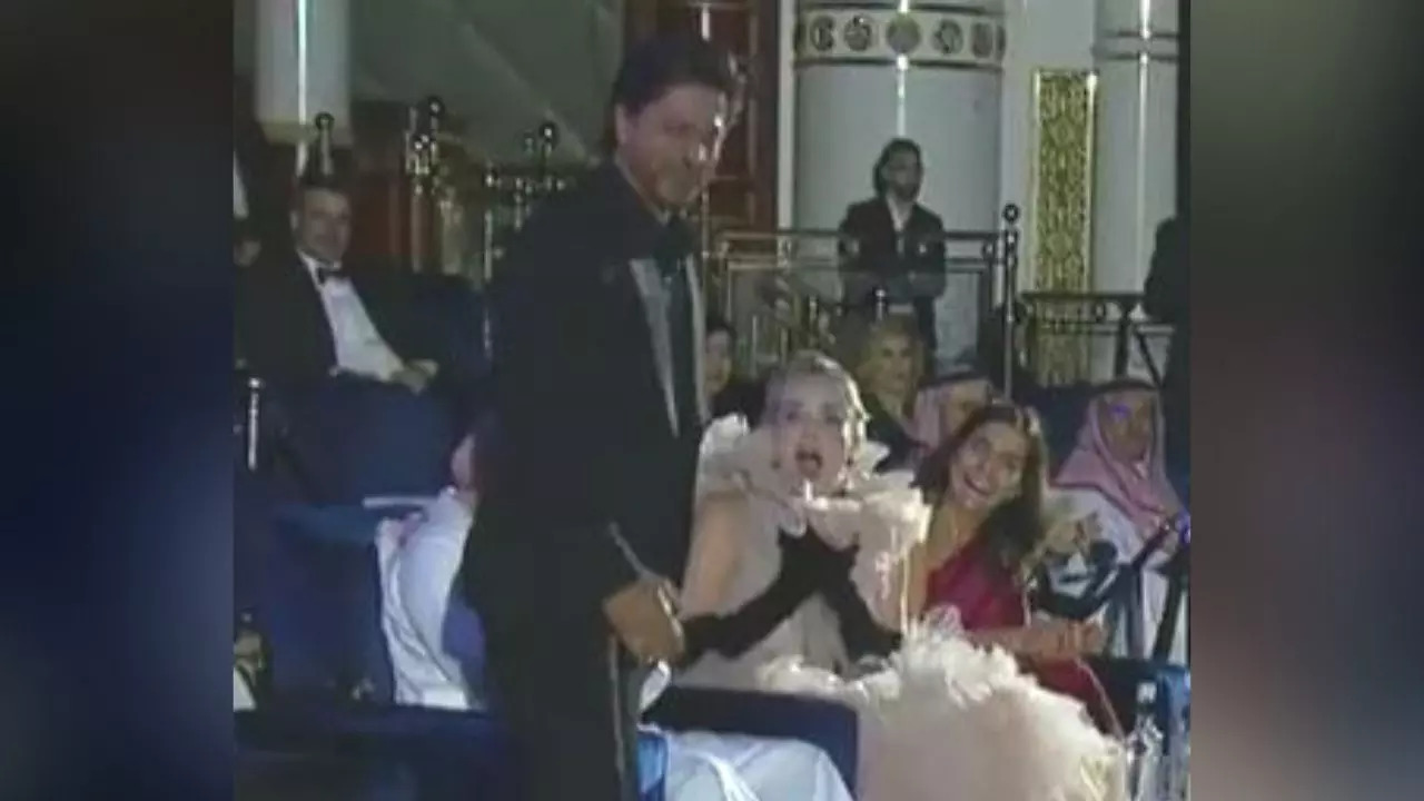 Shah Rukh Khan beside Sharon Stone