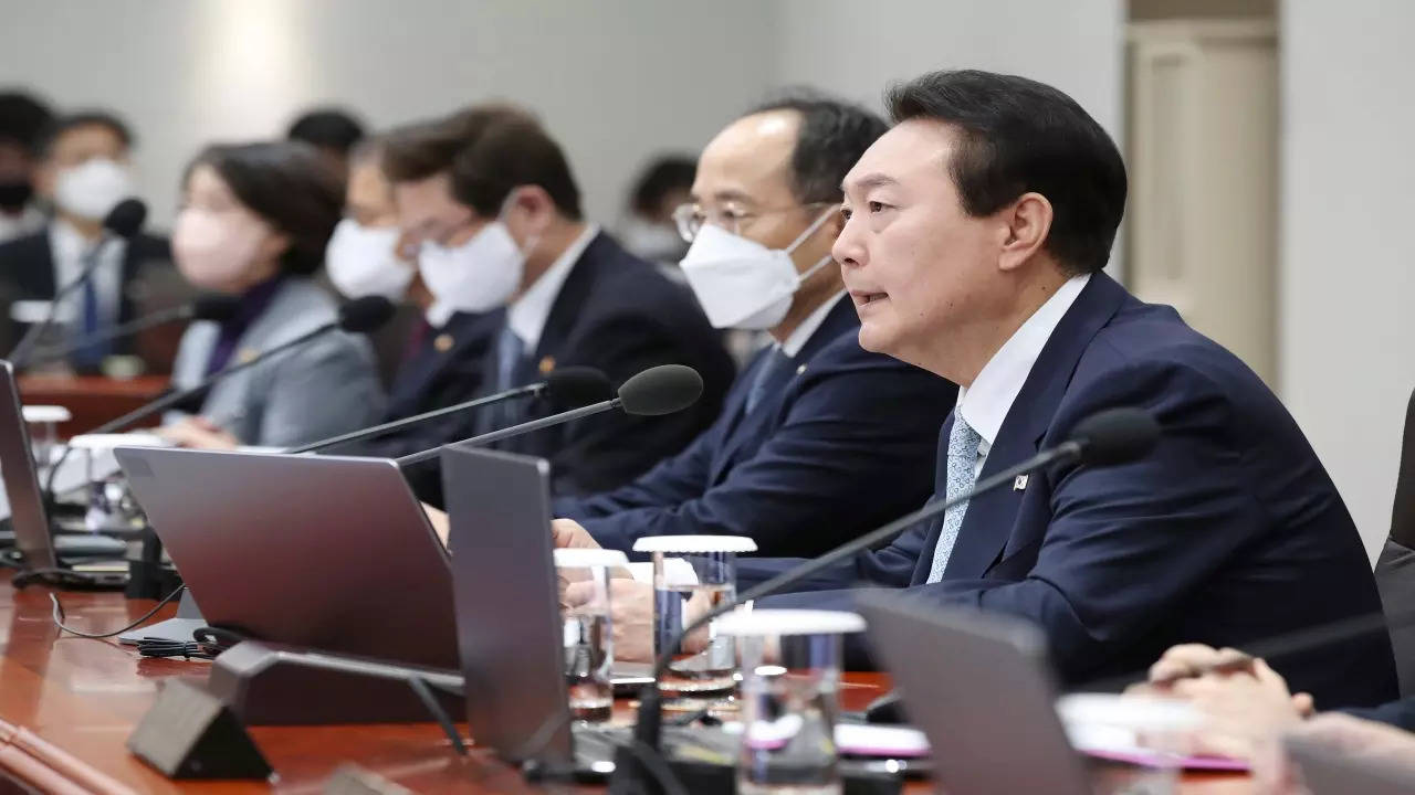 South Korean President Yoon Suk Yeol, right, speaks during a cabinet meeting at the presidential office in Seoul, South Korea, Tuesday, Nov. 29, 2022