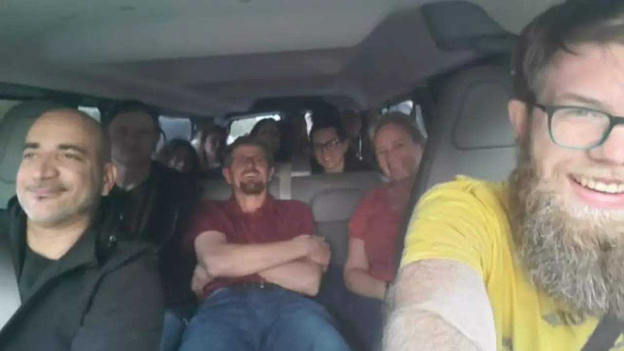 13 strangers take a selfie in a minivan they rented to drive to Knoxville after their flight got cancelled in Orlando | Picture courtesy of Adolf Froese