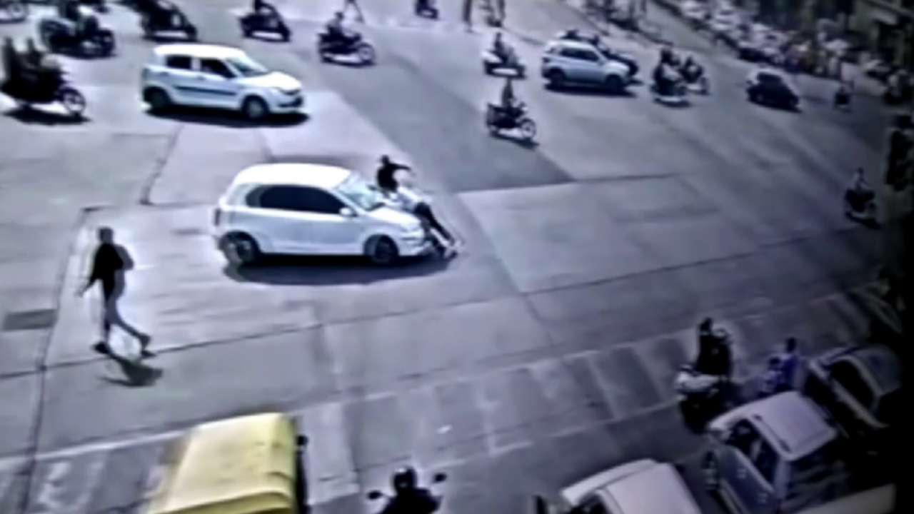 Driver drags traffic cop on bonnet of his car