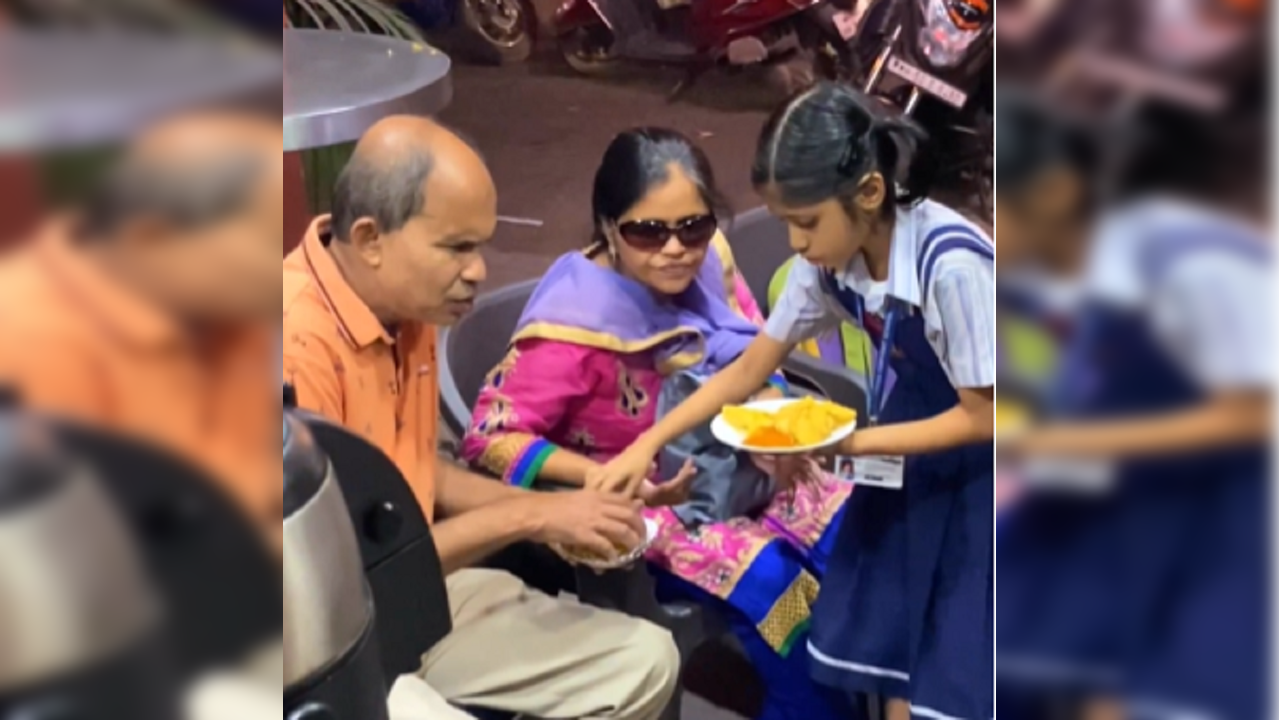 Little girl helps her visually-impaired parents