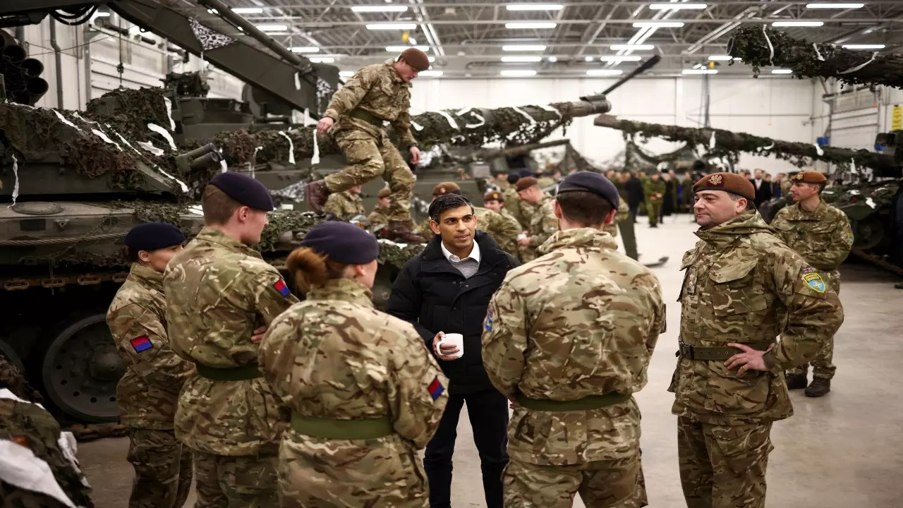 British Prime Minister Rishi Sunak talks with NATO Troops at the Tapa Military base, in Tapa, Estonia, Monday, Dec. 19, 2022.