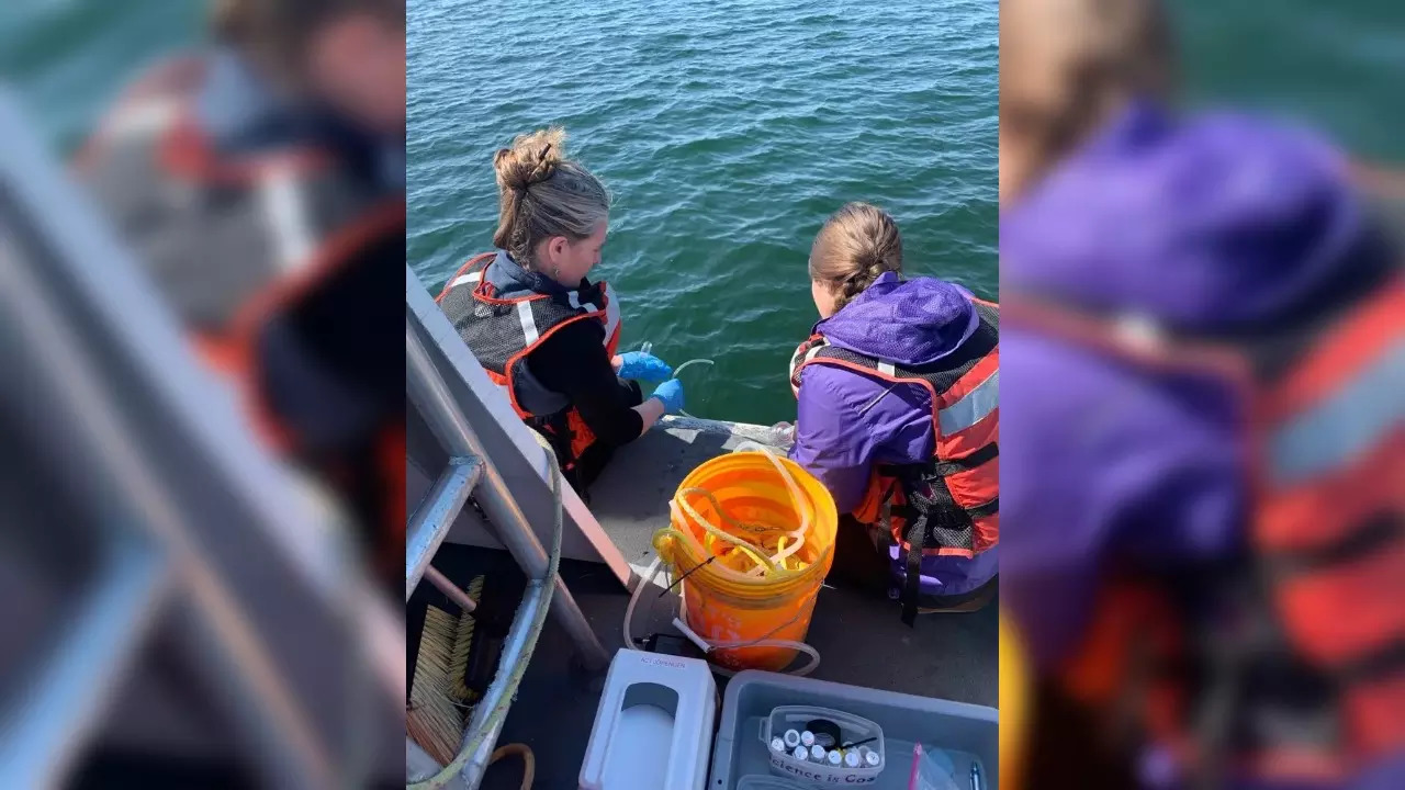 National Oceanic and Atmospheric Administration researchers collect Lake Huron water samples from a research vessel_AP