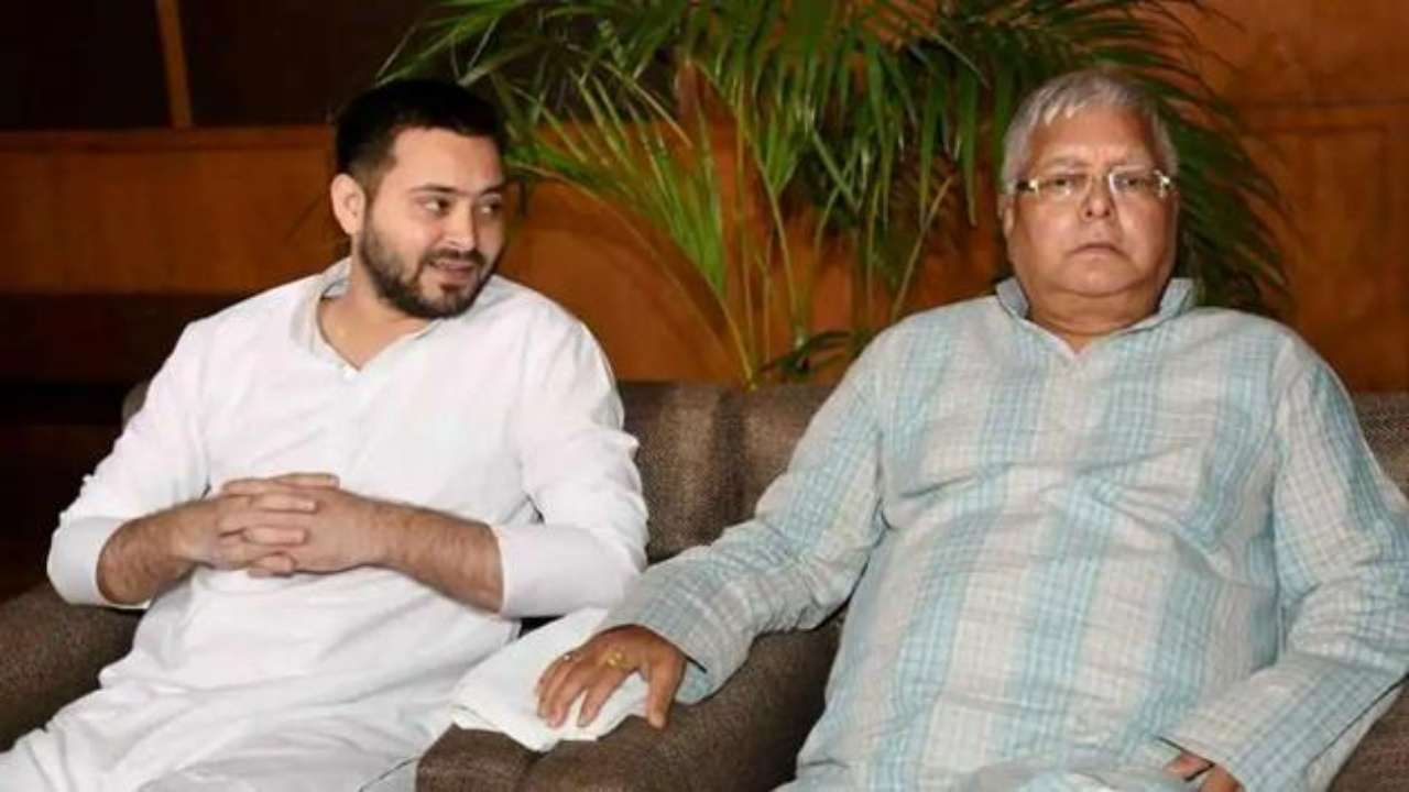 Tejashwi Yadav with Lalu Yadav (File Photo)