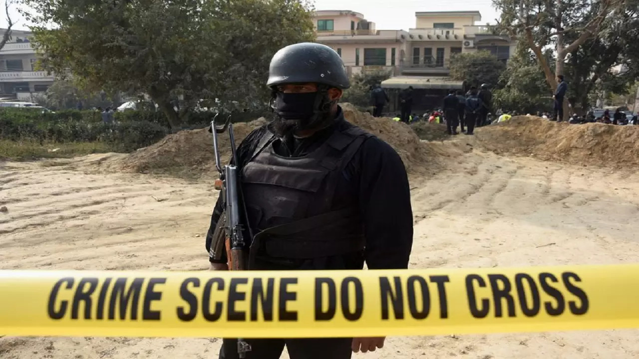 A police officer stands inside cordoned-off area after a suicide car bombing in Islamabad, Pakistan December 23, 2022.