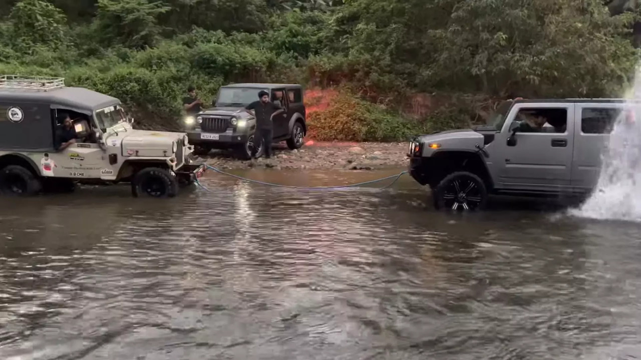 Mahindra Thar rescues Hummer H2 stuck in stream