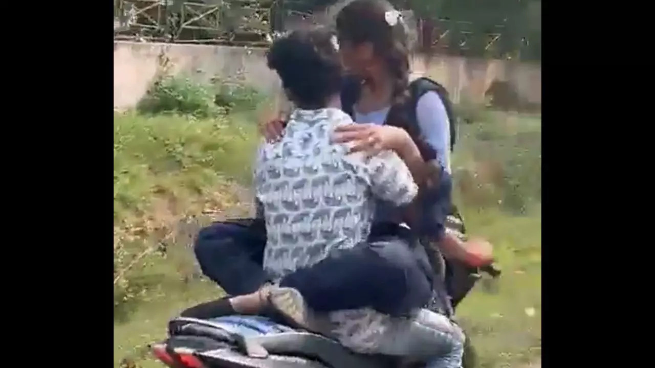 An Andhra Pradesh couple was arrested after a video of them 'hugging' on moving bike in Visakapatnam went viral | Screengrab: Twitter